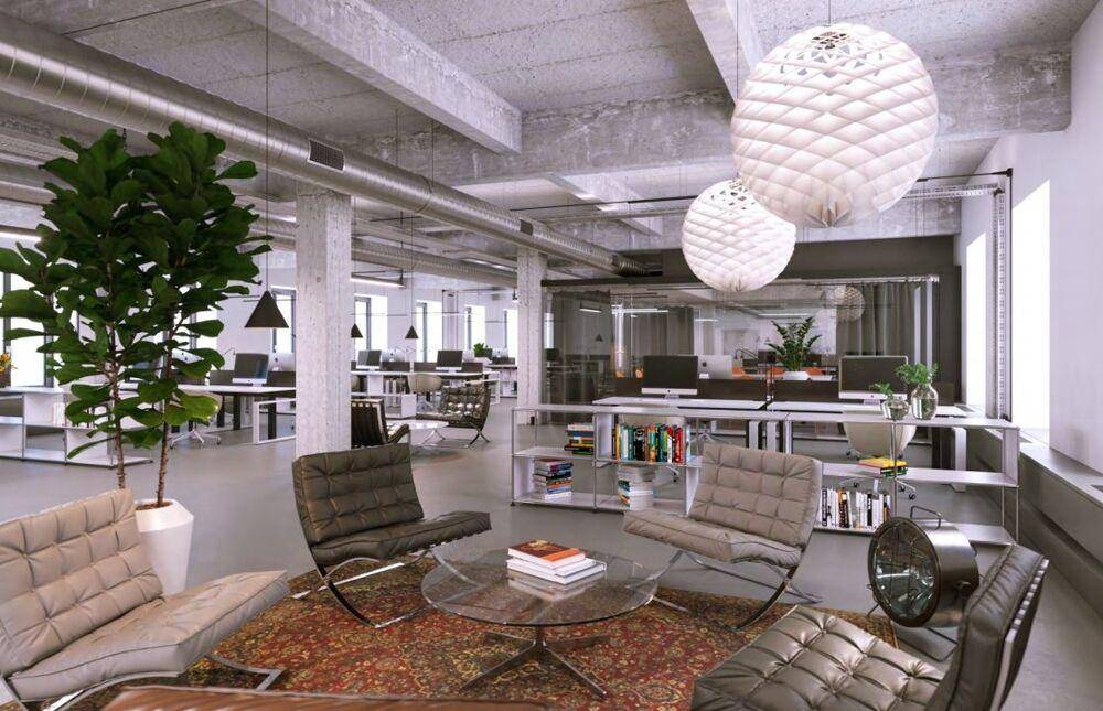 Gemütlicher Loungebereich in einem modernen Büro mit Designermöbeln und Teppich.