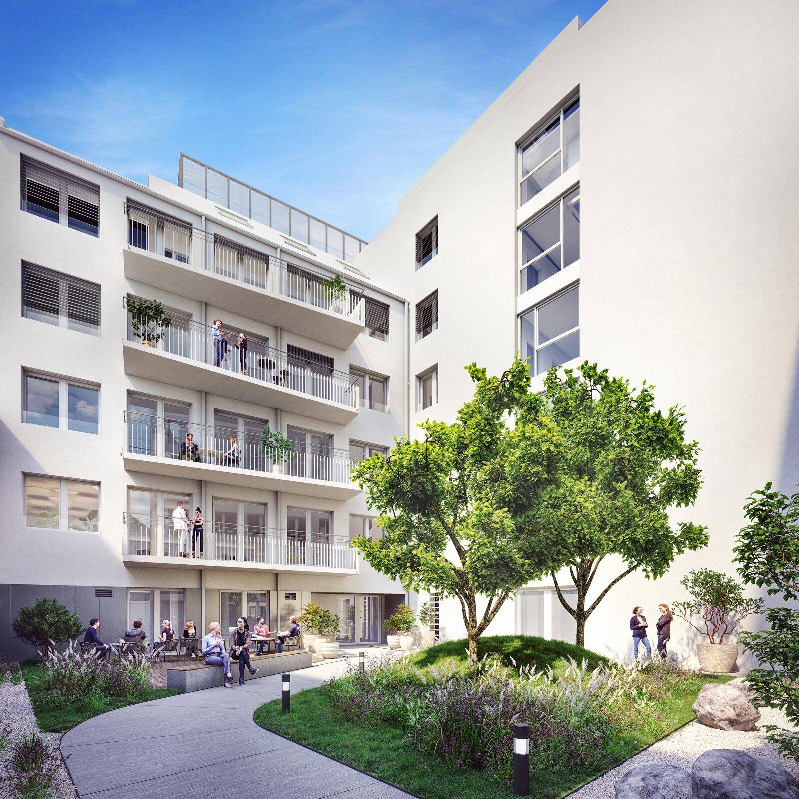Ruhiger Innenhof mit Sitzgelegenheiten, Bäumen und Balkonen, ideal zum Entspannen und Verweilen.