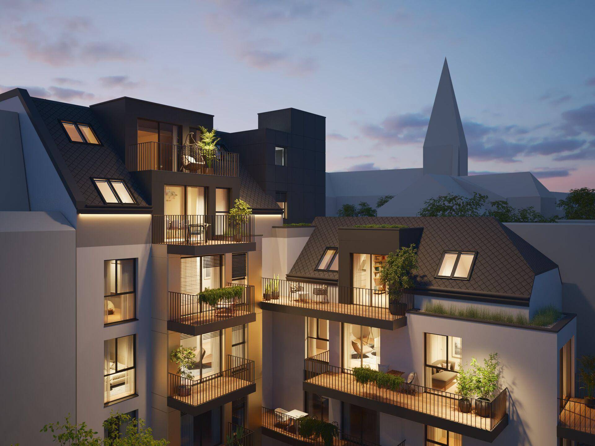 Abendliche Perspektive der Wohnanlage mit mehreren Balkonen und Dachterrassen in urbaner Umgebung.