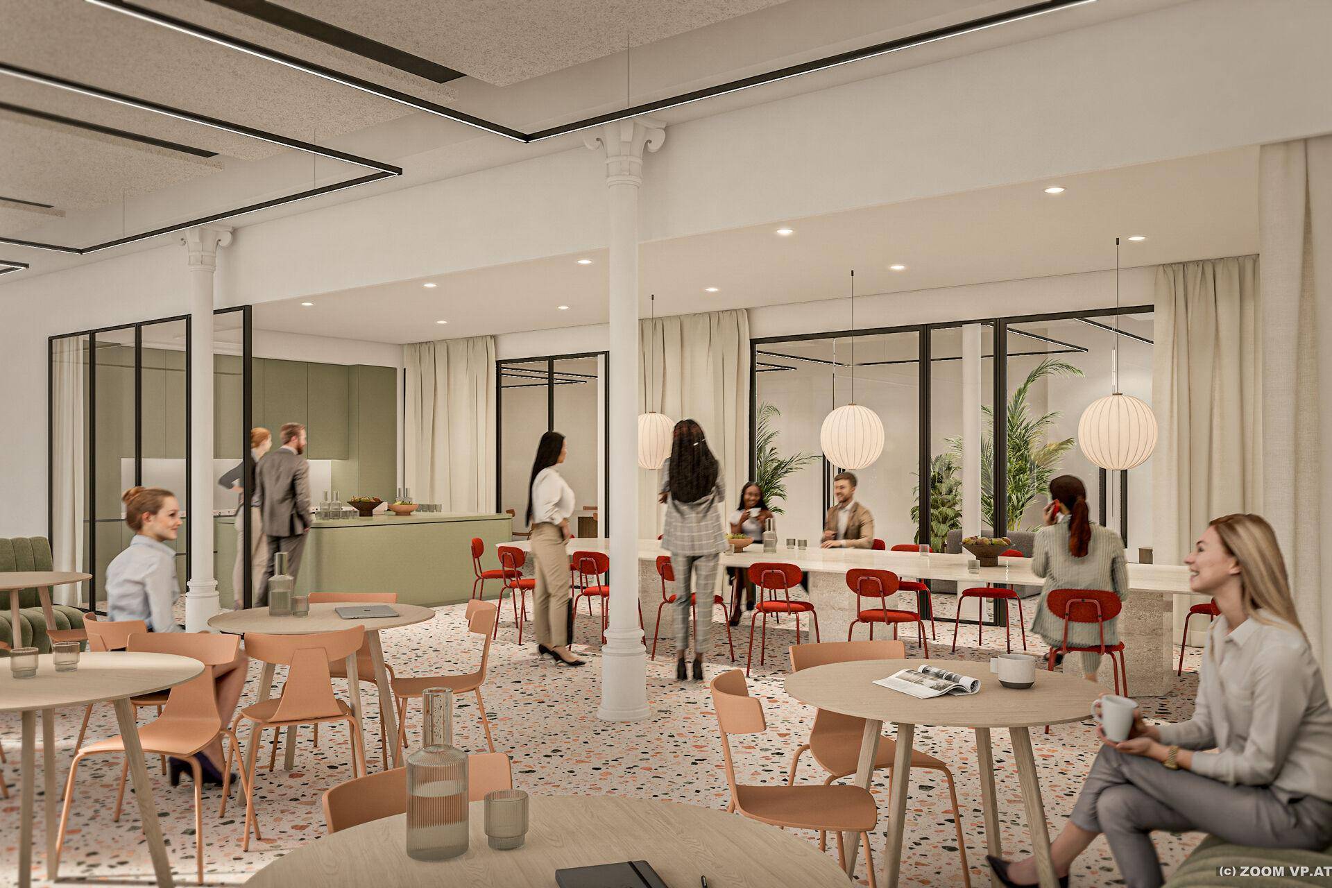 Moderne Cafeteria mit bunten Möbeln, Terrazzoboden und offener Küchenzeile im Hintergrund.