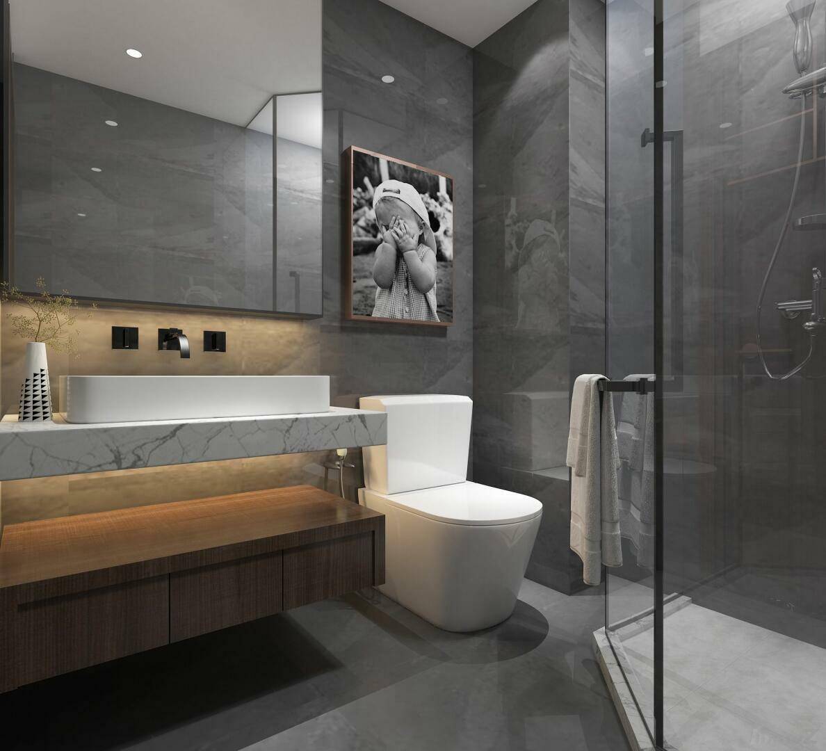 Modernes Badezimmer mit grauen Fliesen, schwebendem Waschtisch und begehbarer Dusche.