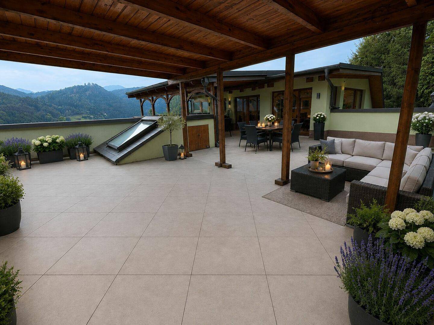 Große Dachterrasse mit Pergola, Lounge-Möbeln und Essbereich, bietet einen weiten Bergblick.
