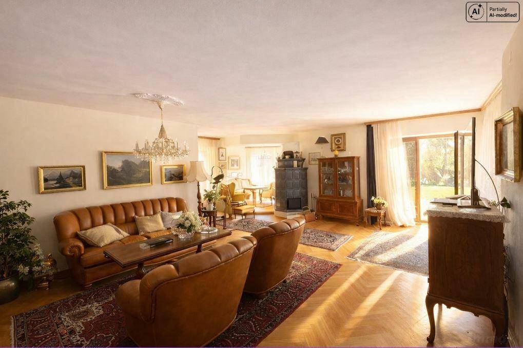 Großzügiges Wohnzimmer mit Kachelofen, Zugang zum Garten und klassischer Einrichtung.