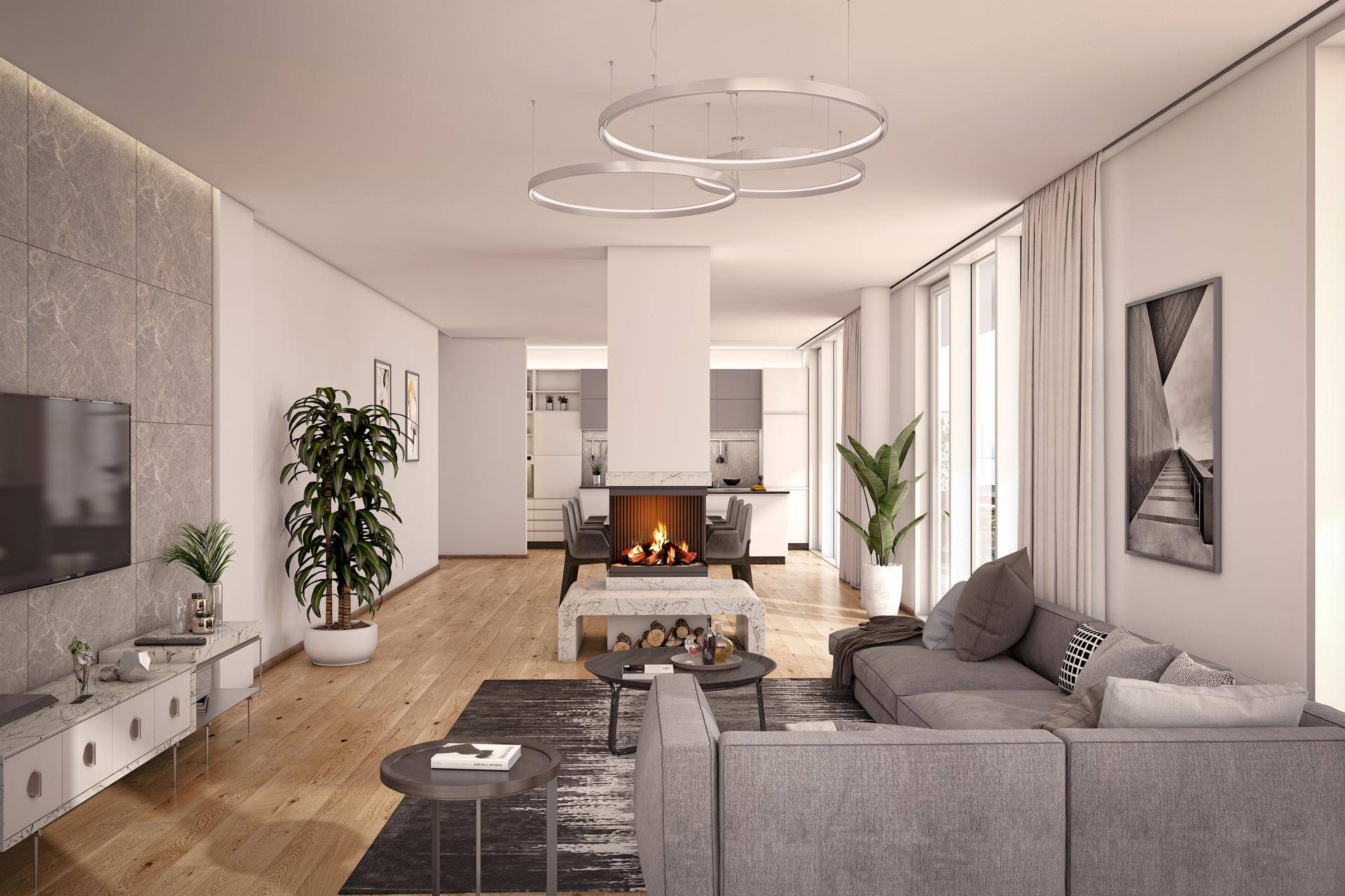 Helles, modernes Wohnzimmer mit Kamin, Holzboden und offenem Übergang zum Essbereich und zur Küche.