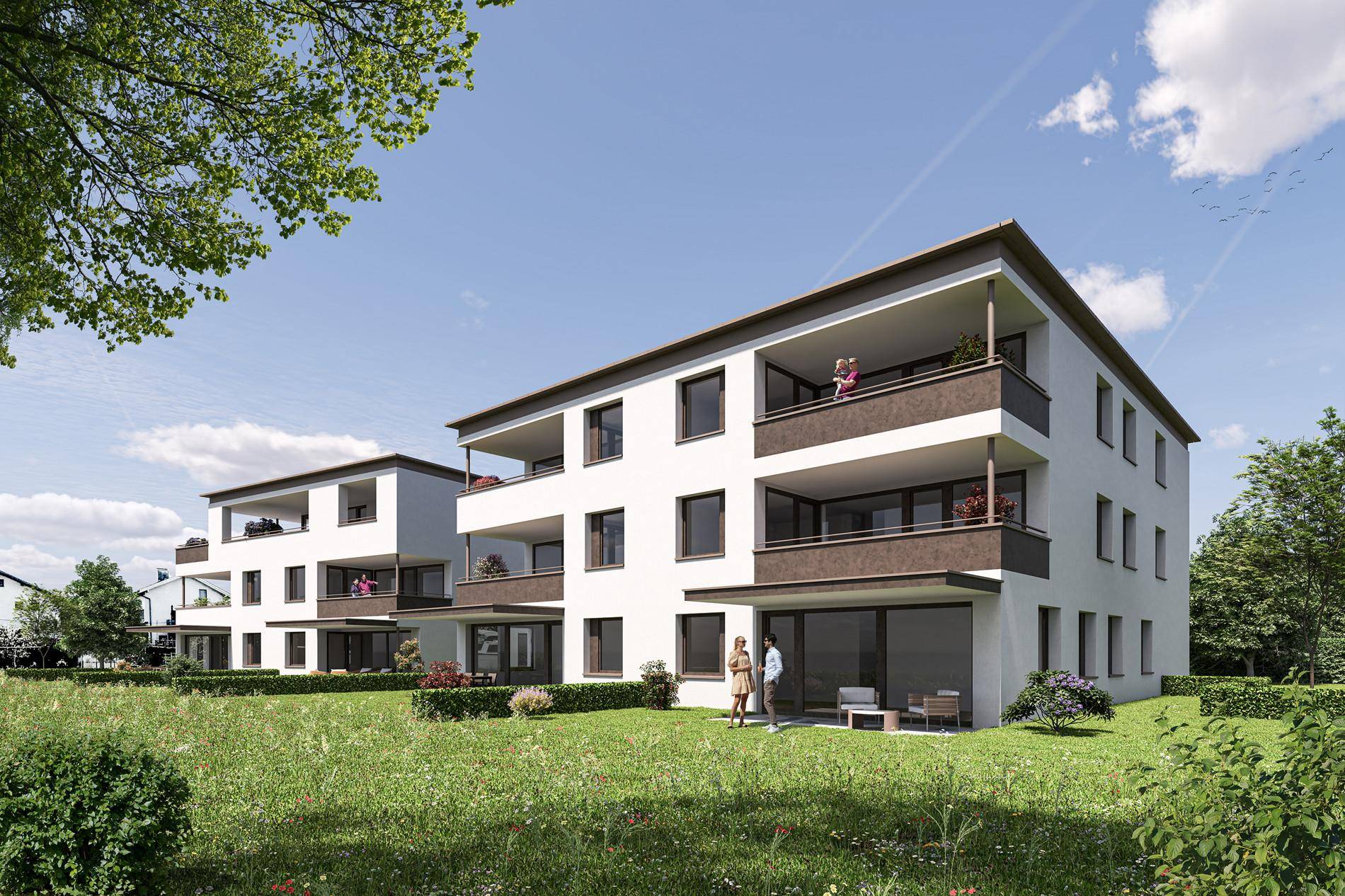 Ansicht der modernen Wohngebäude von der Gartenseite mit Balkonen und Terrassen im Erdgeschoss.