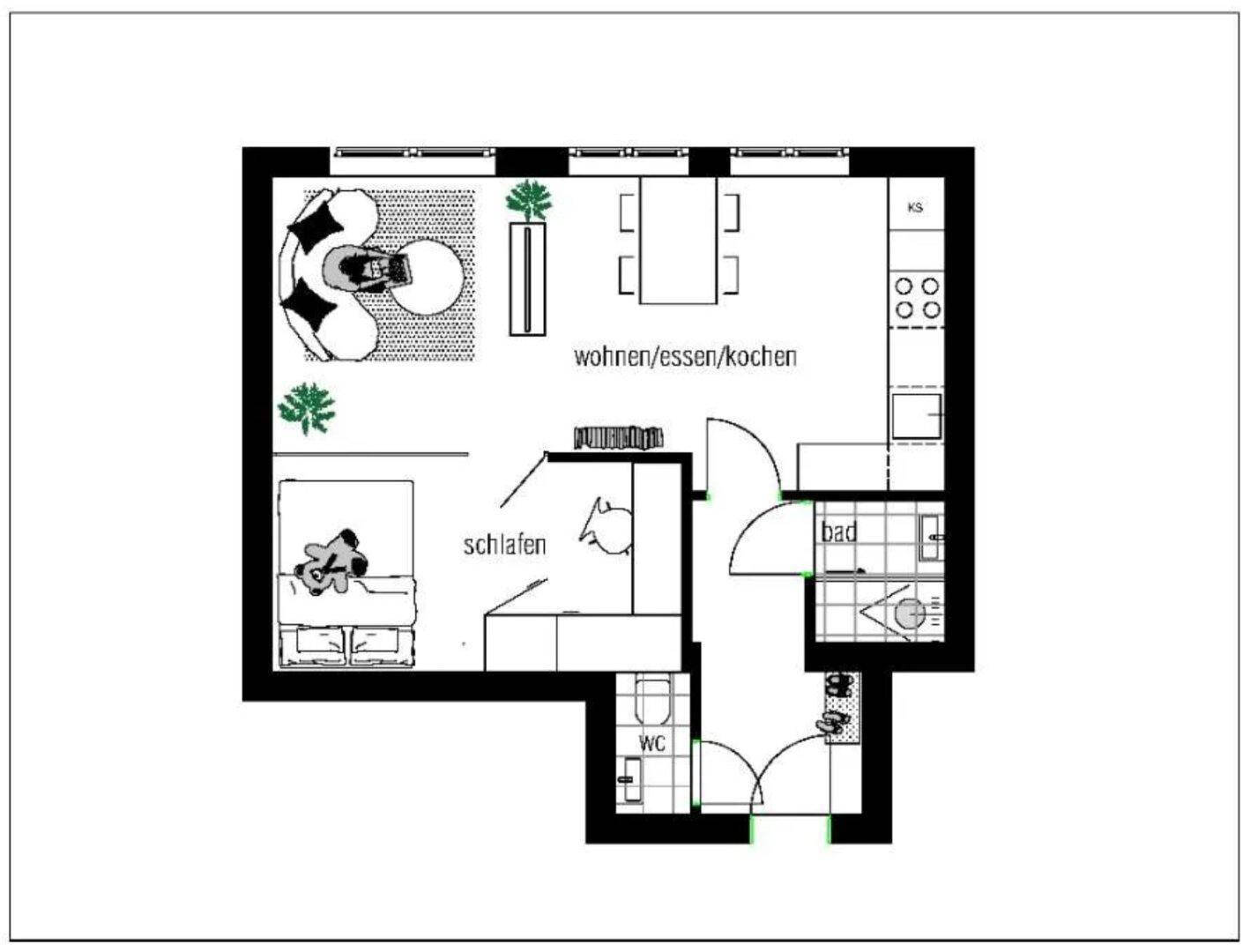 Grundriss der Wohnung mit offenem Wohn-, Ess- und Kochbereich sowie separatem Schlafzimmer.
