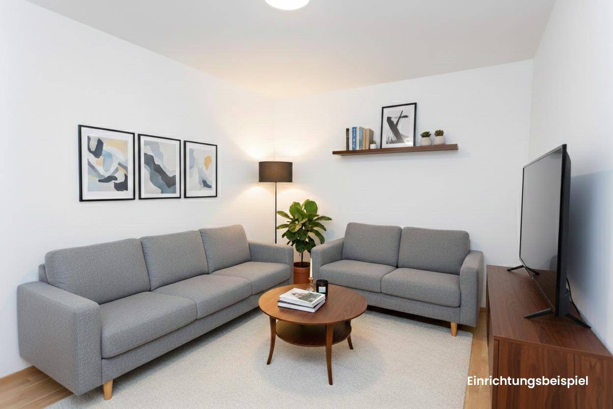 Modernes Wohnzimmer mit grauen Sofas, Couchtisch und Wandregalen, als Einrichtungsbeispiel dargestellt.