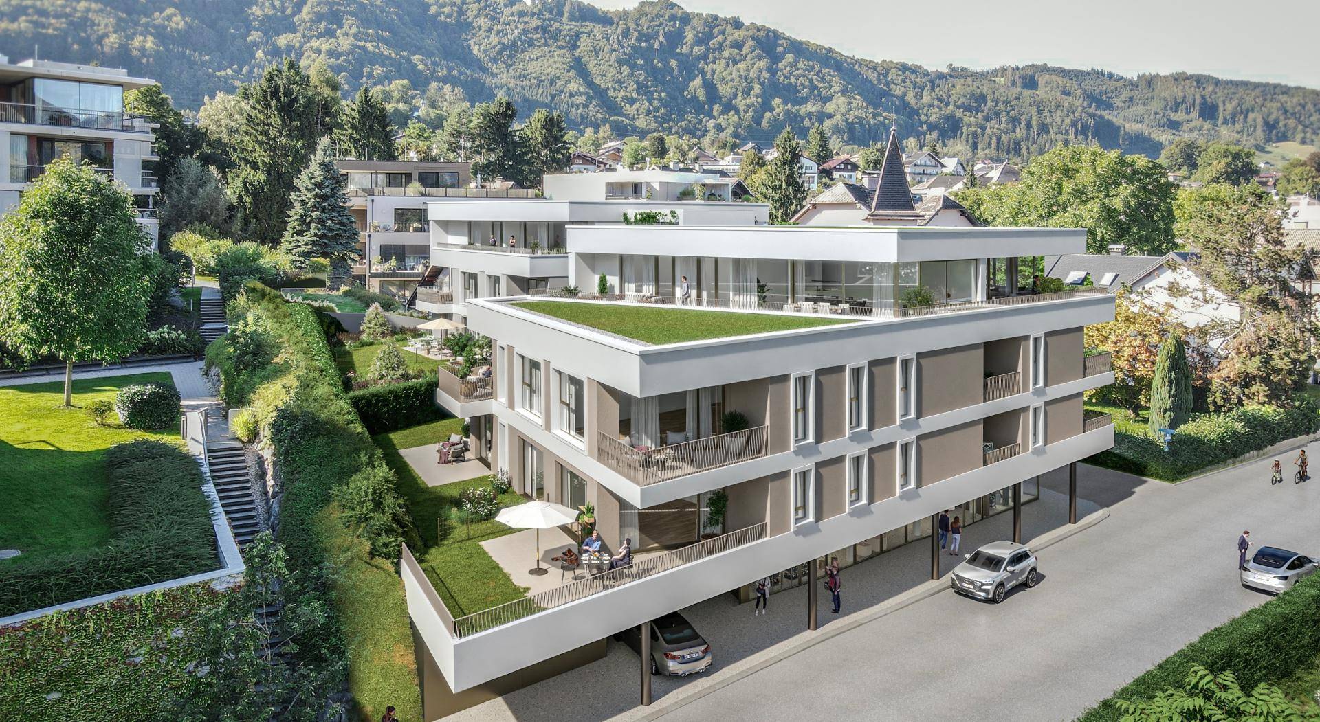 Zeitgenössische Wohnanlage mit Terrassen und Grünflächen, harmonisch in die Landschaft integriert.