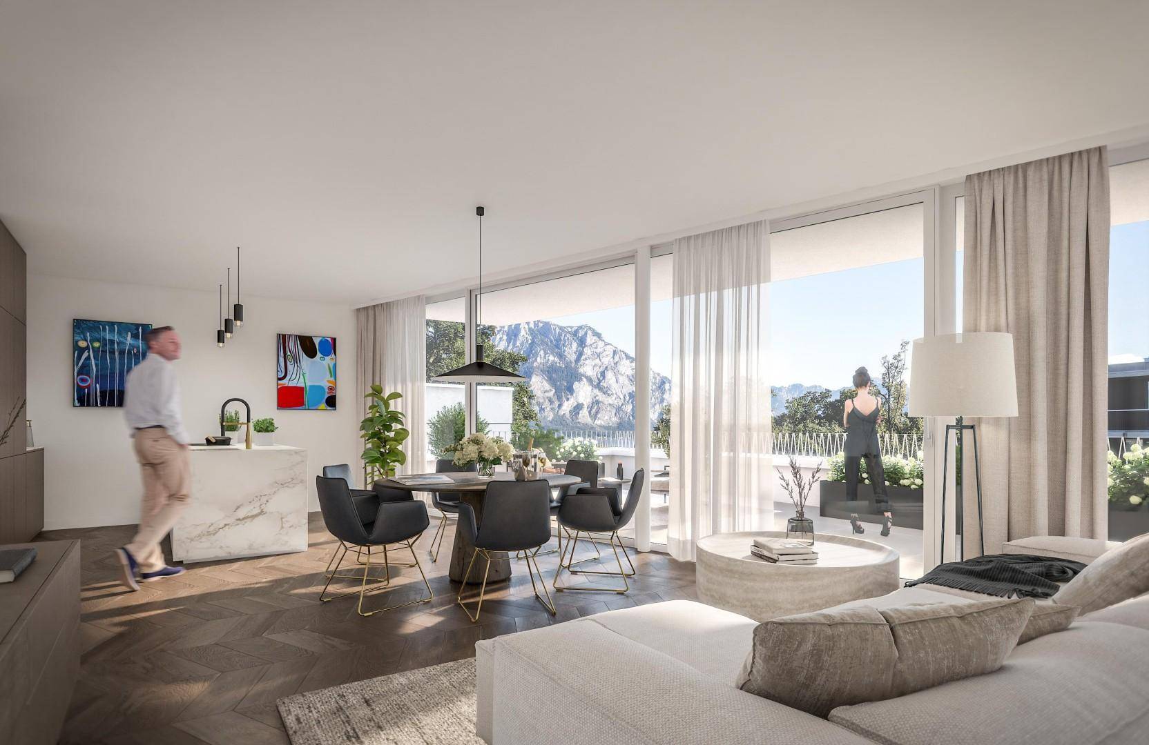 Offener Wohnbereich mit moderner Küche, Terrasse und beeindruckendem Bergblick durch Panoramafenster.