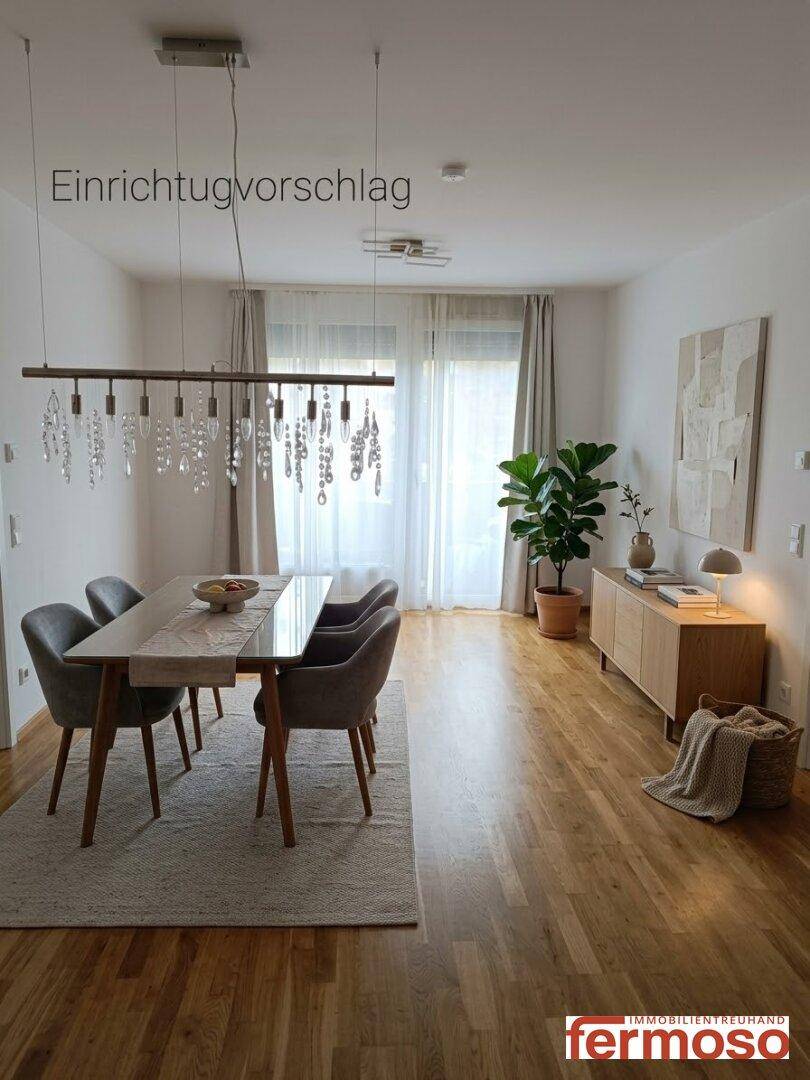 Gemütlicher Wohnbereich mit Holzboden, modernen Möbeln und großem Fenster als Einrichtungsvorschlag.