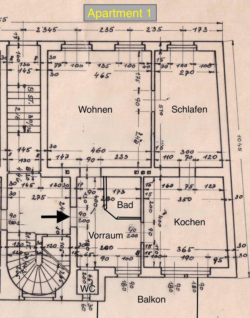 Detaillierter Grundriss der Wohnung 1 mit separaten Bereichen für Wohnen, Schlafen, Bad und Küche.