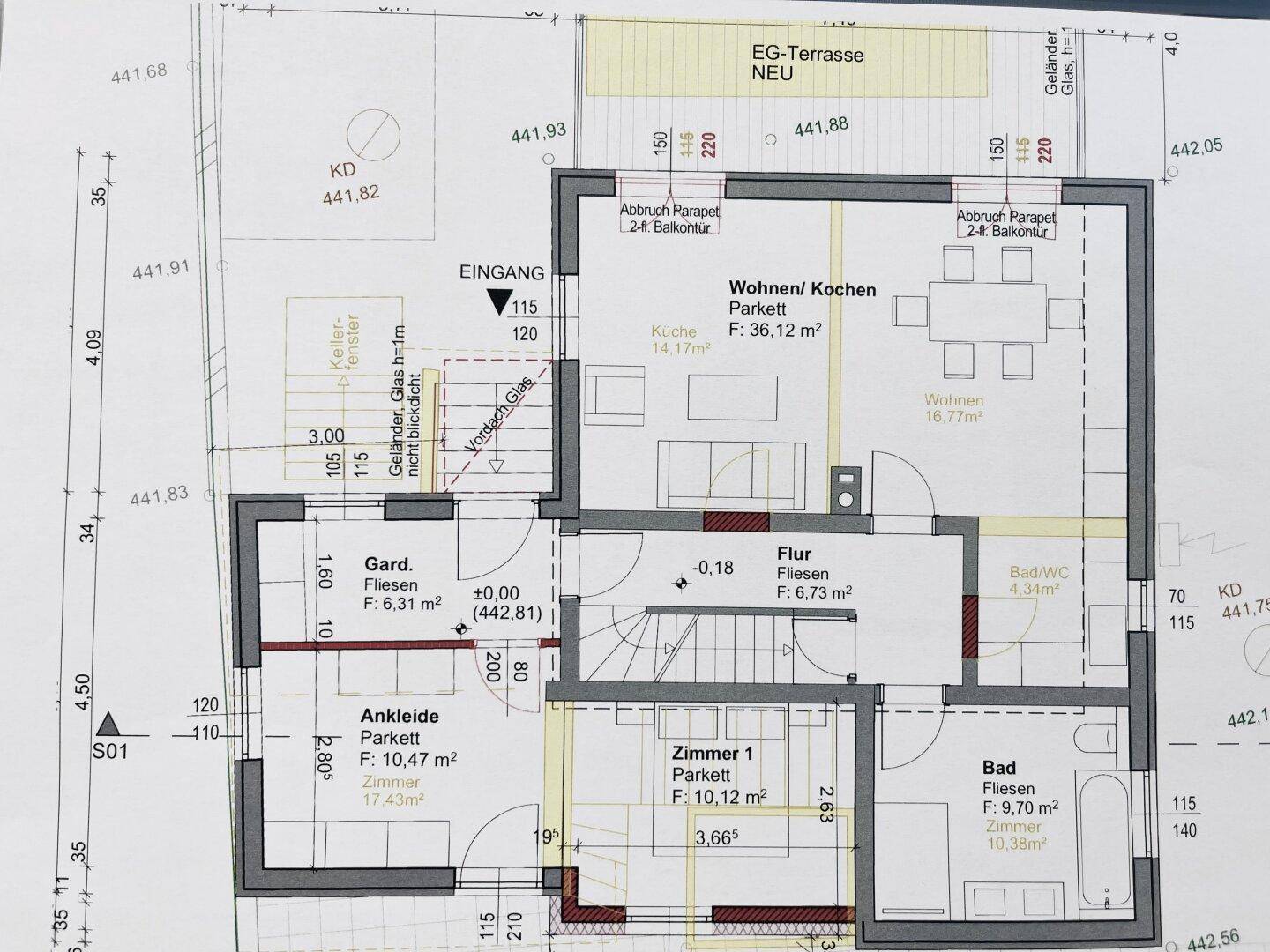 Grundriss des Erdgeschosses mit Wohn-/Kochbereich, Ankleide und Terrasse.