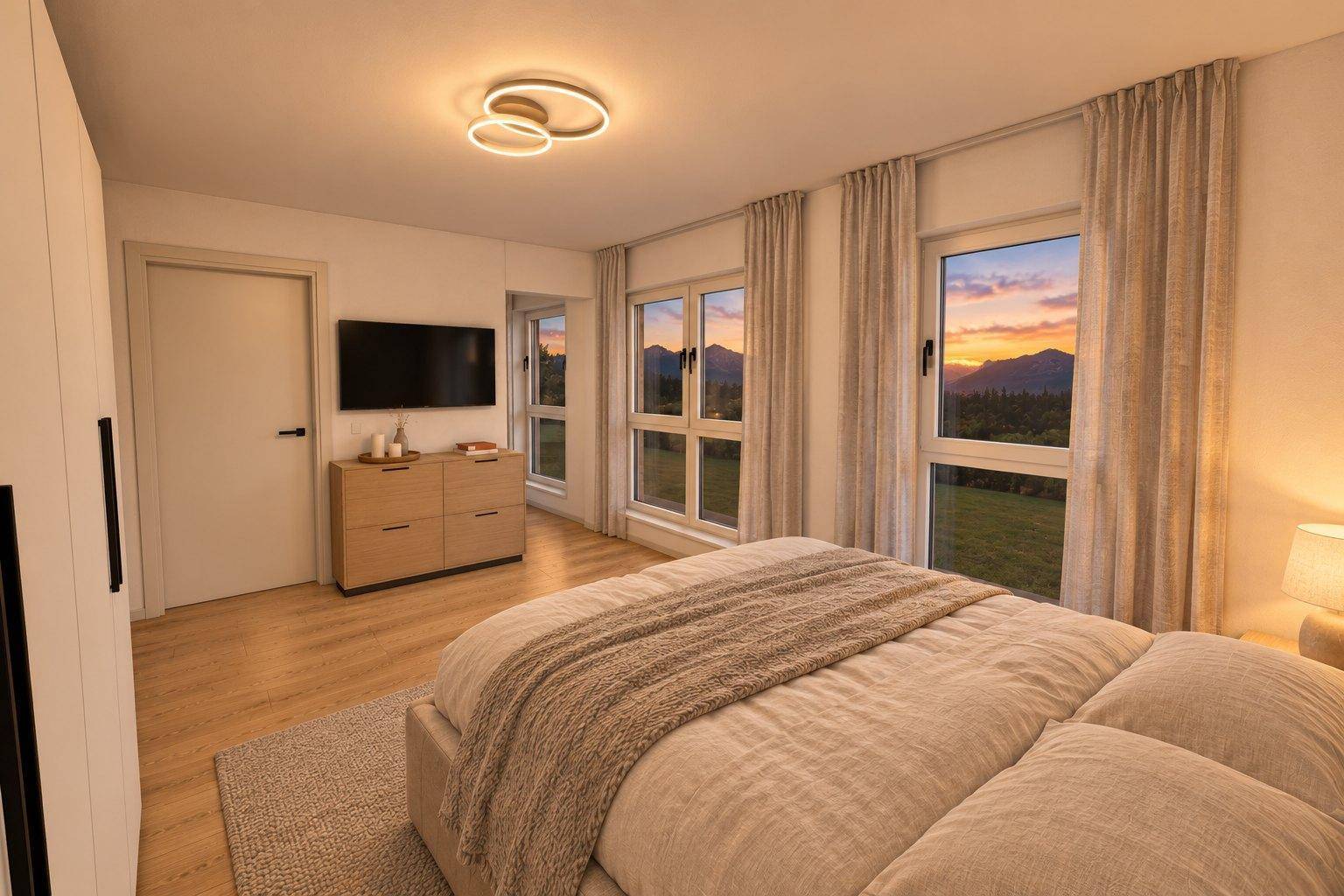 Helles Schlafzimmer mit Holzboden, großem Bett und Fenstern, die einen weiten Bergblick bieten.