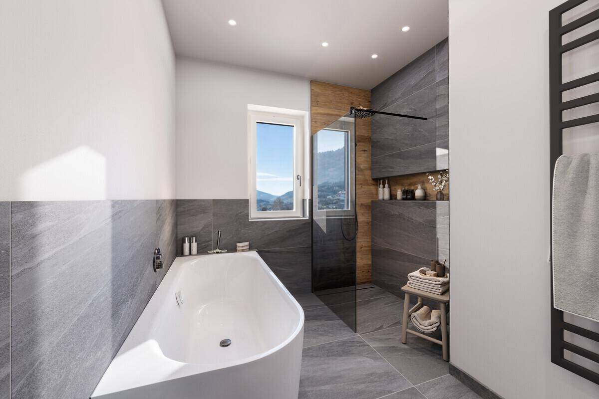 Modernes Badezimmer mit Badewanne, begehbarer Dusche und grauen Fliesen.