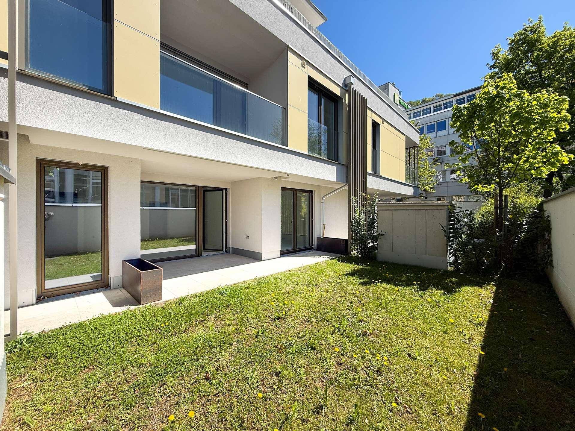 Moderne Erdgeschosswohnung mit privatem Gartenbereich und sonniger Terrasse.