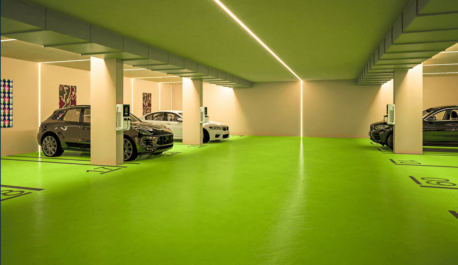 Helle Tiefgarage mit mehreren Ladestationen für Elektrofahrzeuge und moderner Beleuchtung.