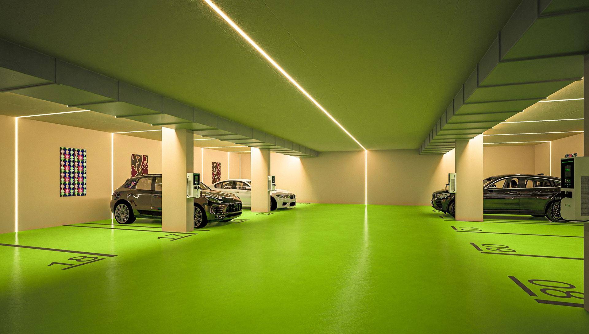 Helle Tiefgarage mit markierten Stellplätzen und moderner Beleuchtung.