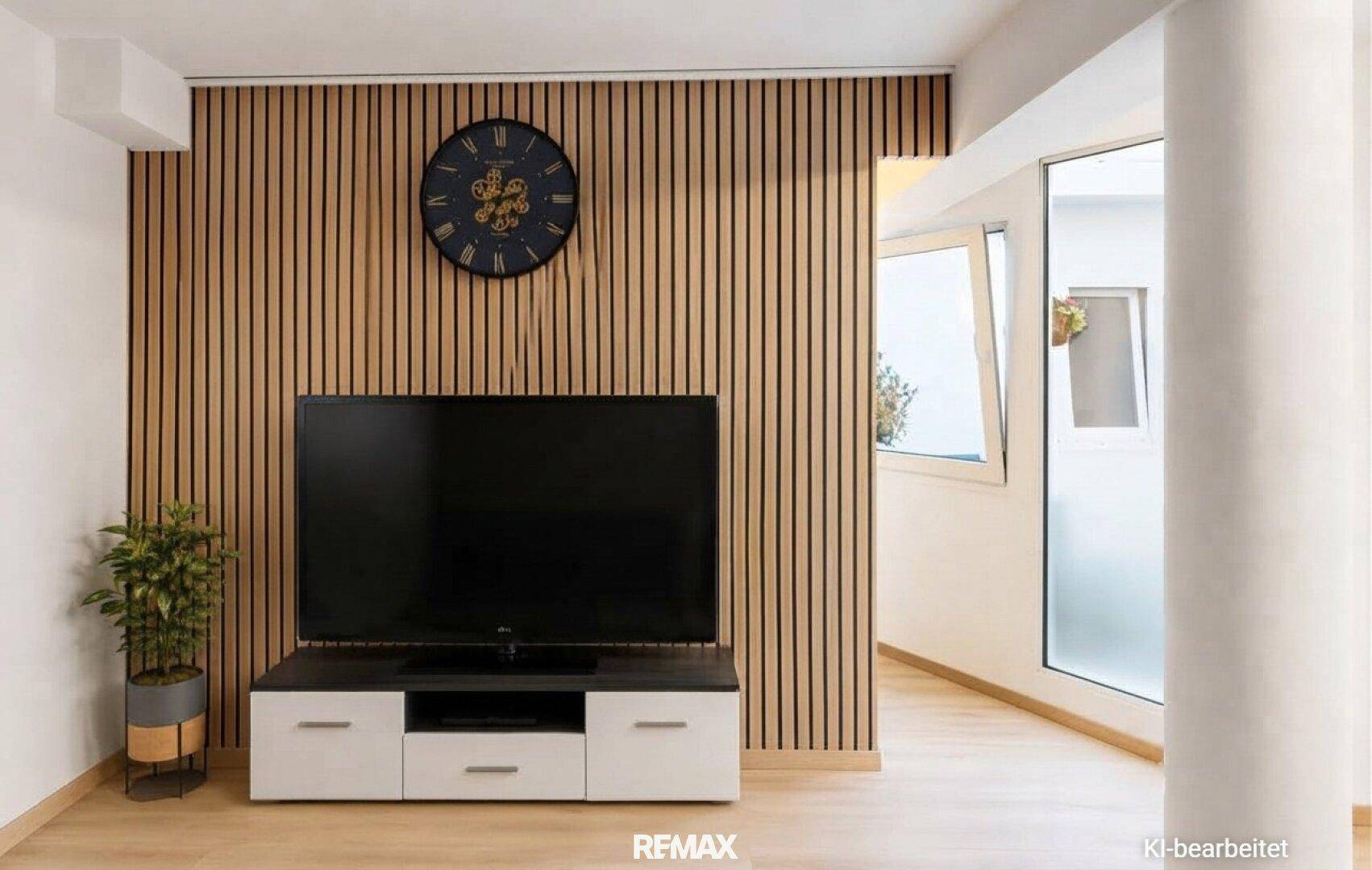 Wohnbereich mit modernem TV-Möbel und dekorativer Holzlamellenwand.