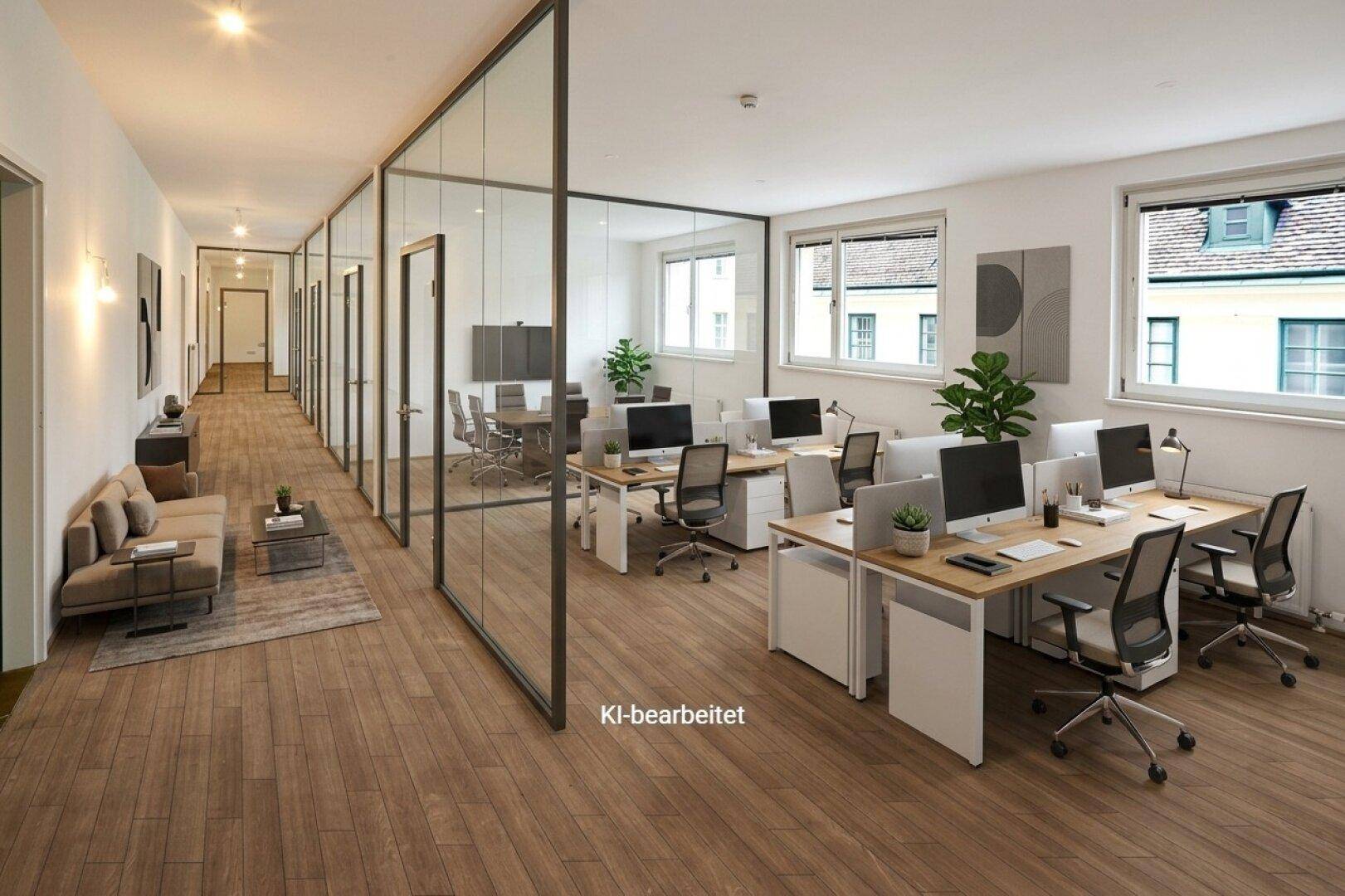 Langer Flur mit Glaswänden, der zu modernen Büroräumen führt, inklusive offener Arbeitsbereiche und einer Lounge.
