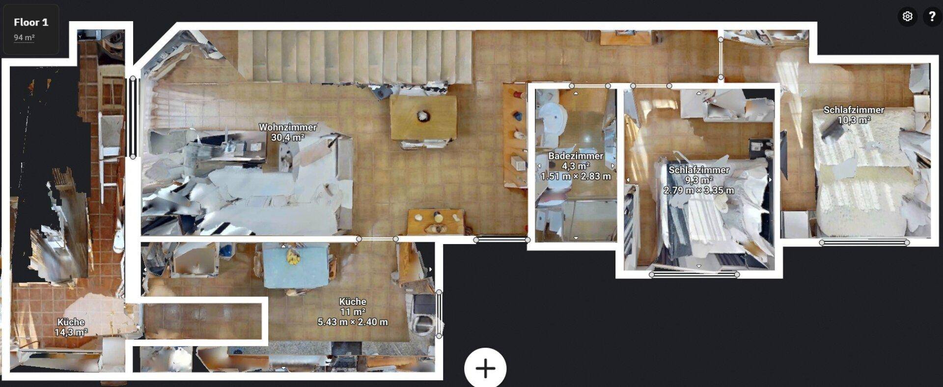 Grundriss des ersten Stocks mit offenem Wohnbereich, Küche und Schlafzimmern.