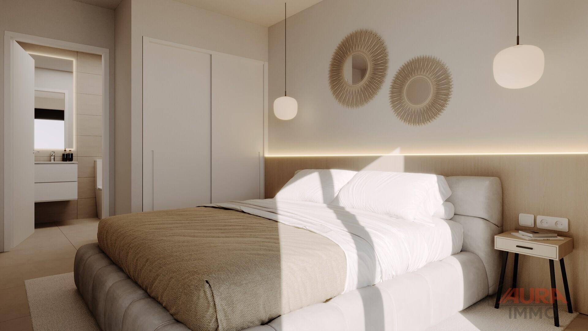 Komfortables Schlafzimmer mit Einbauschränken und angrenzendem Badezimmer, hell und modern gestaltet.