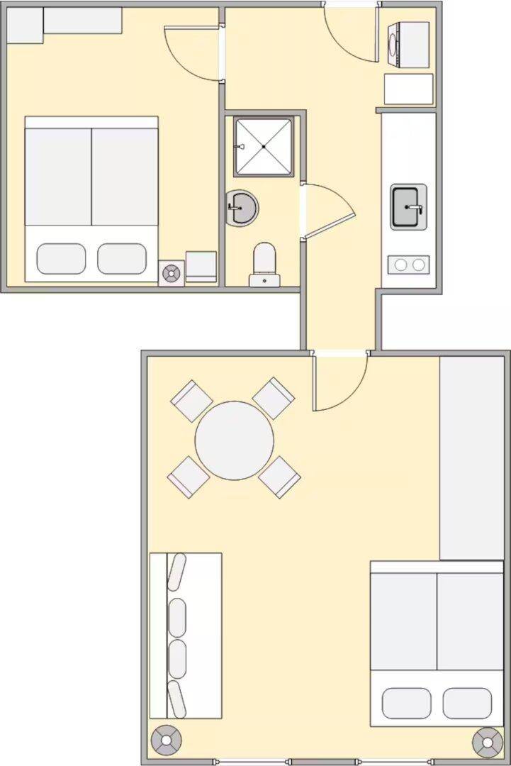 Grundriss einer Wohnung mit zwei Schlafzimmern, offenem Wohnbereich und separater Küche.