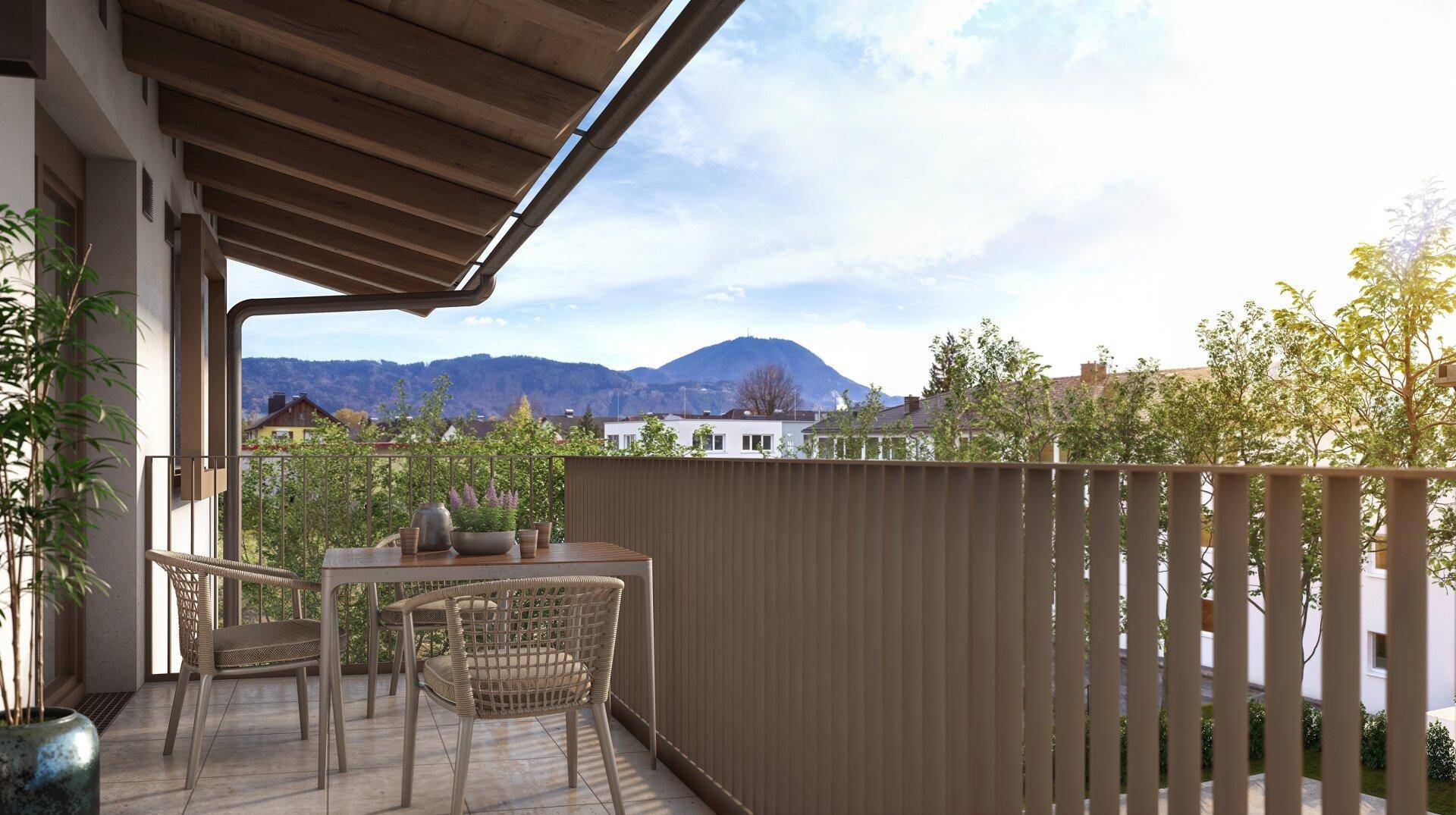 Gemütlicher Balkon mit Sitzgelegenheiten und weitem Blick auf die umliegende Berglandschaft.
