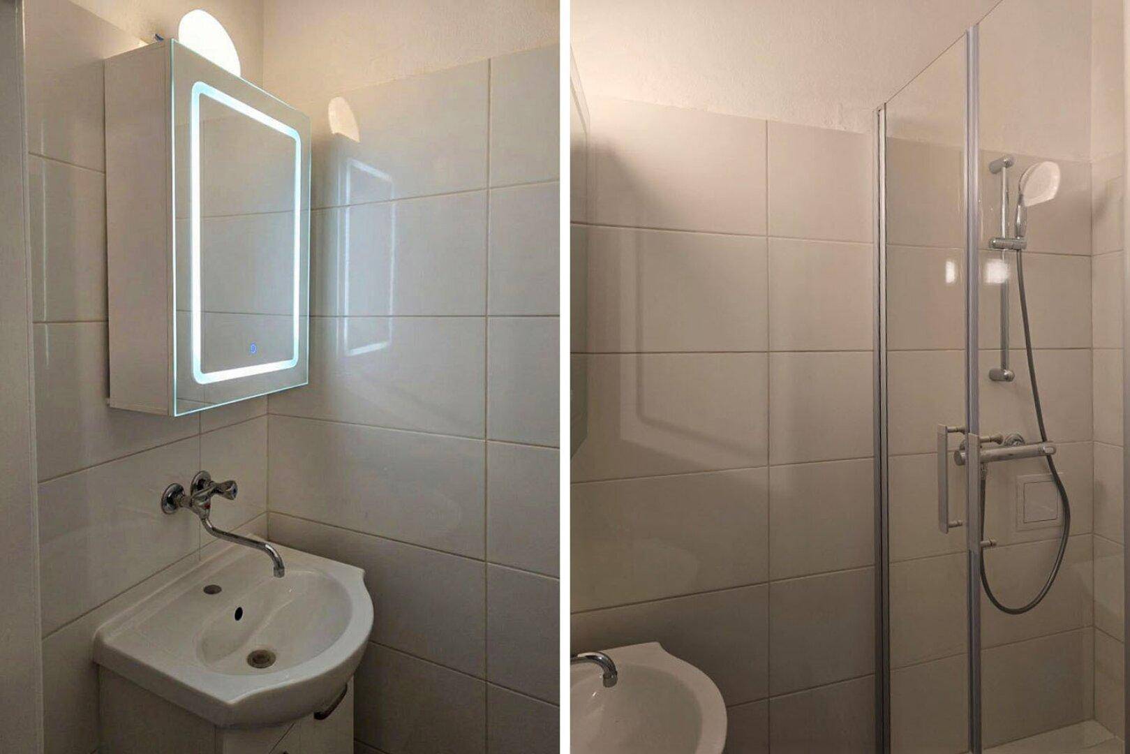 Modernes Badezimmer mit weiß gefliesten Wänden, Waschbecken, beleuchtetem Spiegelschrank und Duschkabine.