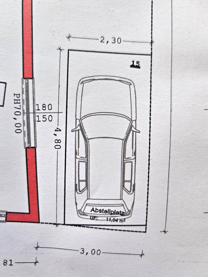 Detailansicht eines Grundrisses mit einem eingezeichneten Abstellplatz für ein Fahrzeug.