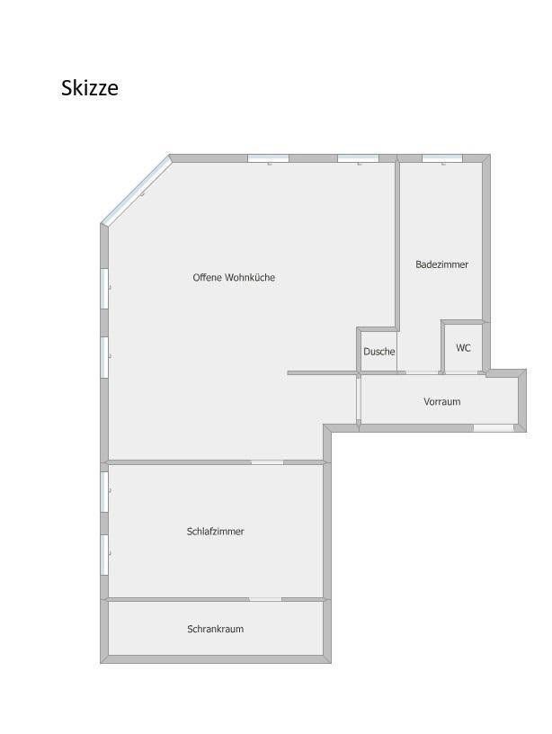 Grundrissplan einer Wohnung mit offener Wohnküche, Schlafzimmer und separatem Bad.