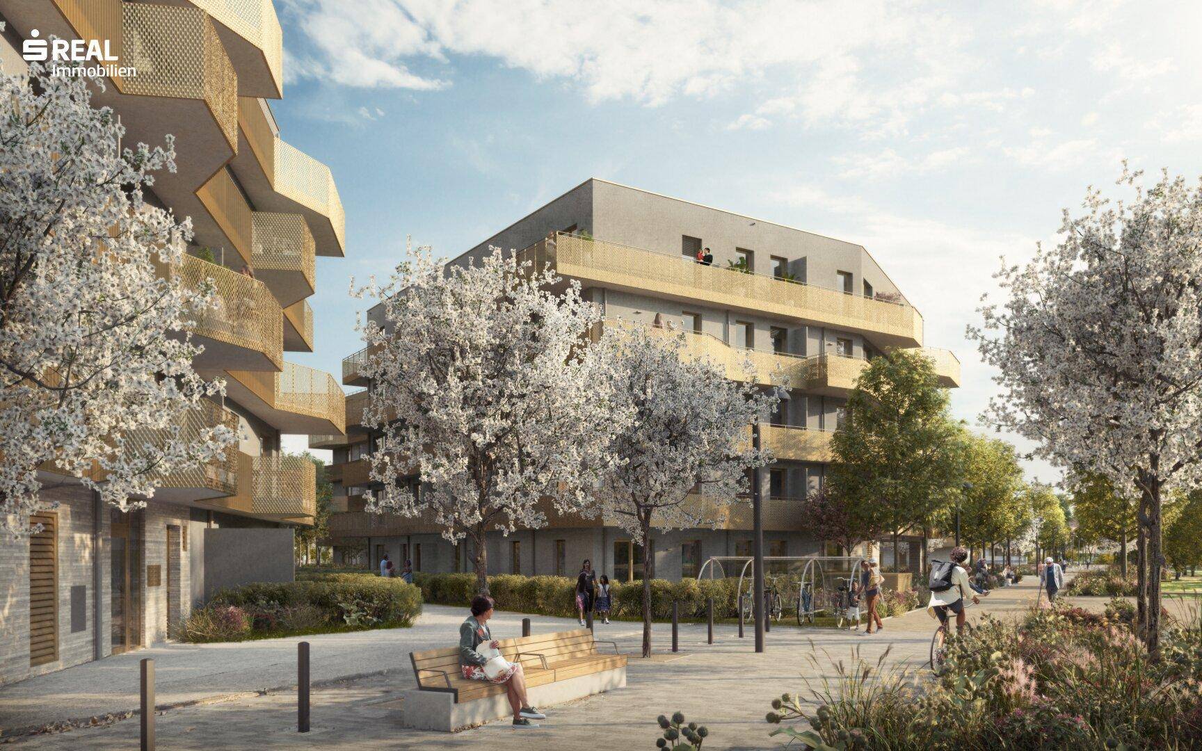 Moderne Wohngebäude mit attraktiven Außenbereichen und Sitzgelegenheiten im Grünen.