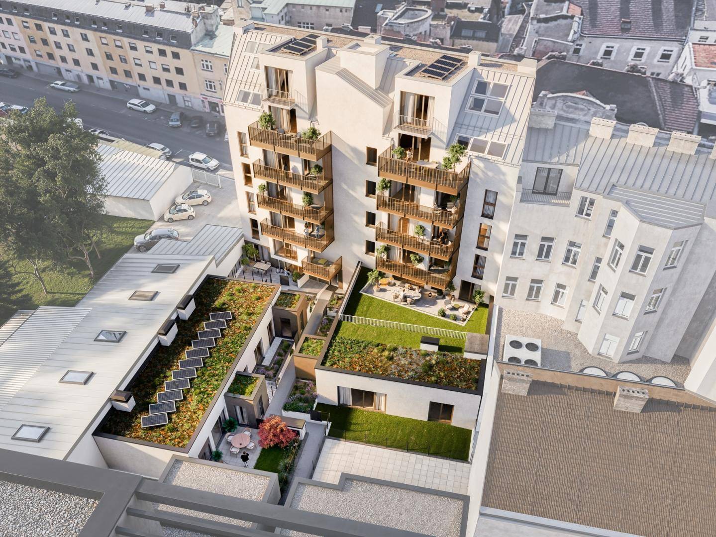 Luftaufnahme der modernen Wohnanlage mit begrünten Dächern, Balkonen und umliegender Stadtlandschaft.