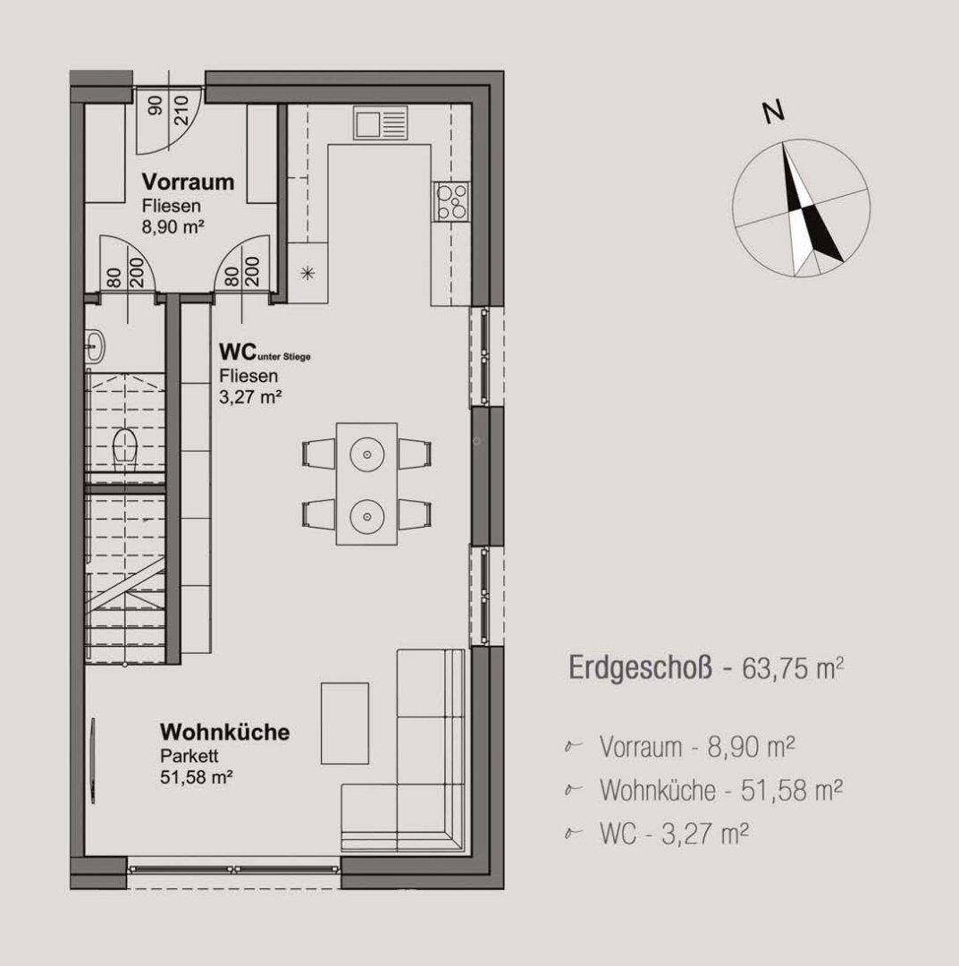 Grundriss des Erdgeschosses mit offener Wohnküche, separatem Vorraum und Gäste-WC.