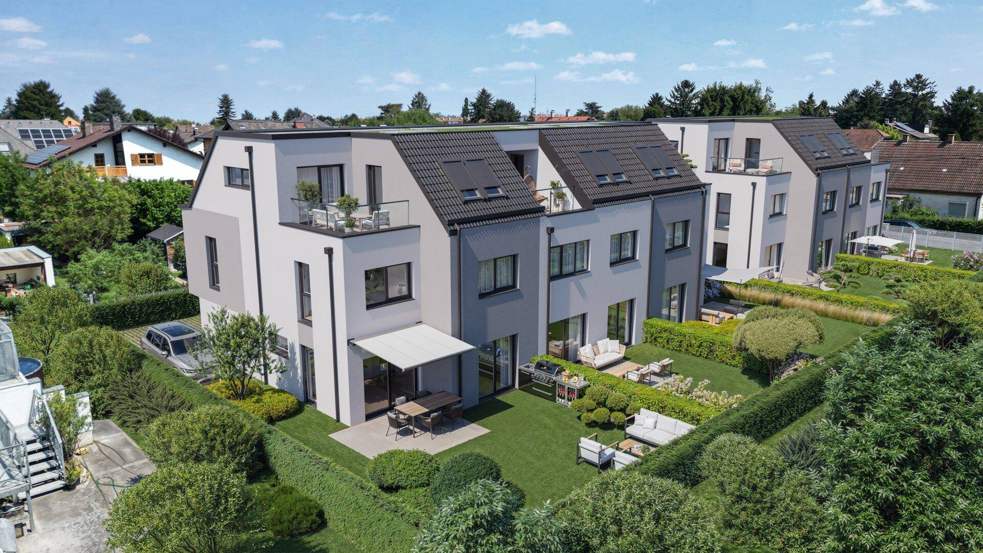 Reihenhäuser mit privaten Gärten, Terrassen und Balkonen in einer ruhigen Wohngegend.