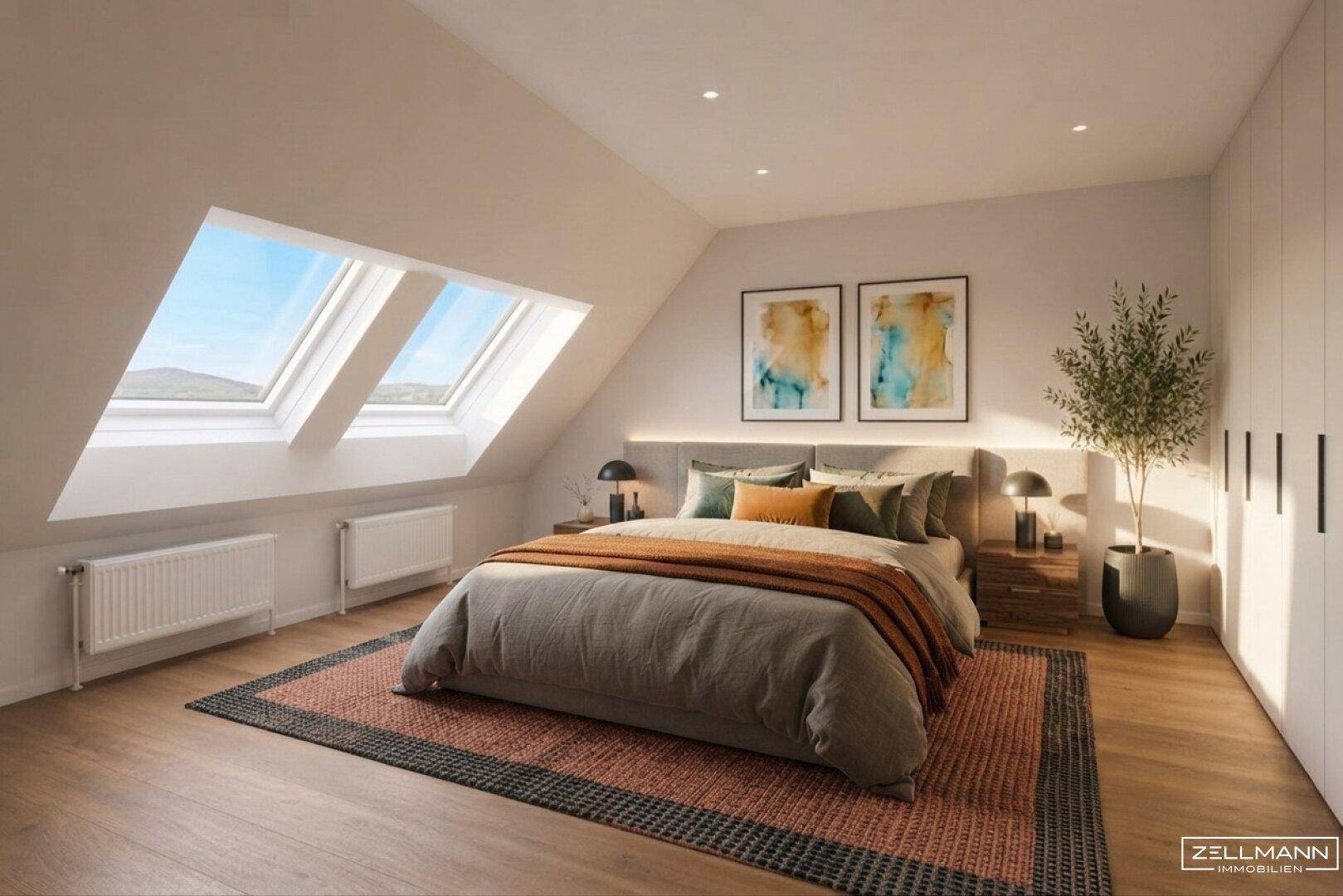 Helles Schlafzimmer mit Dachschrägen, Holzboden und großen Dachfenstern für viel Licht.
