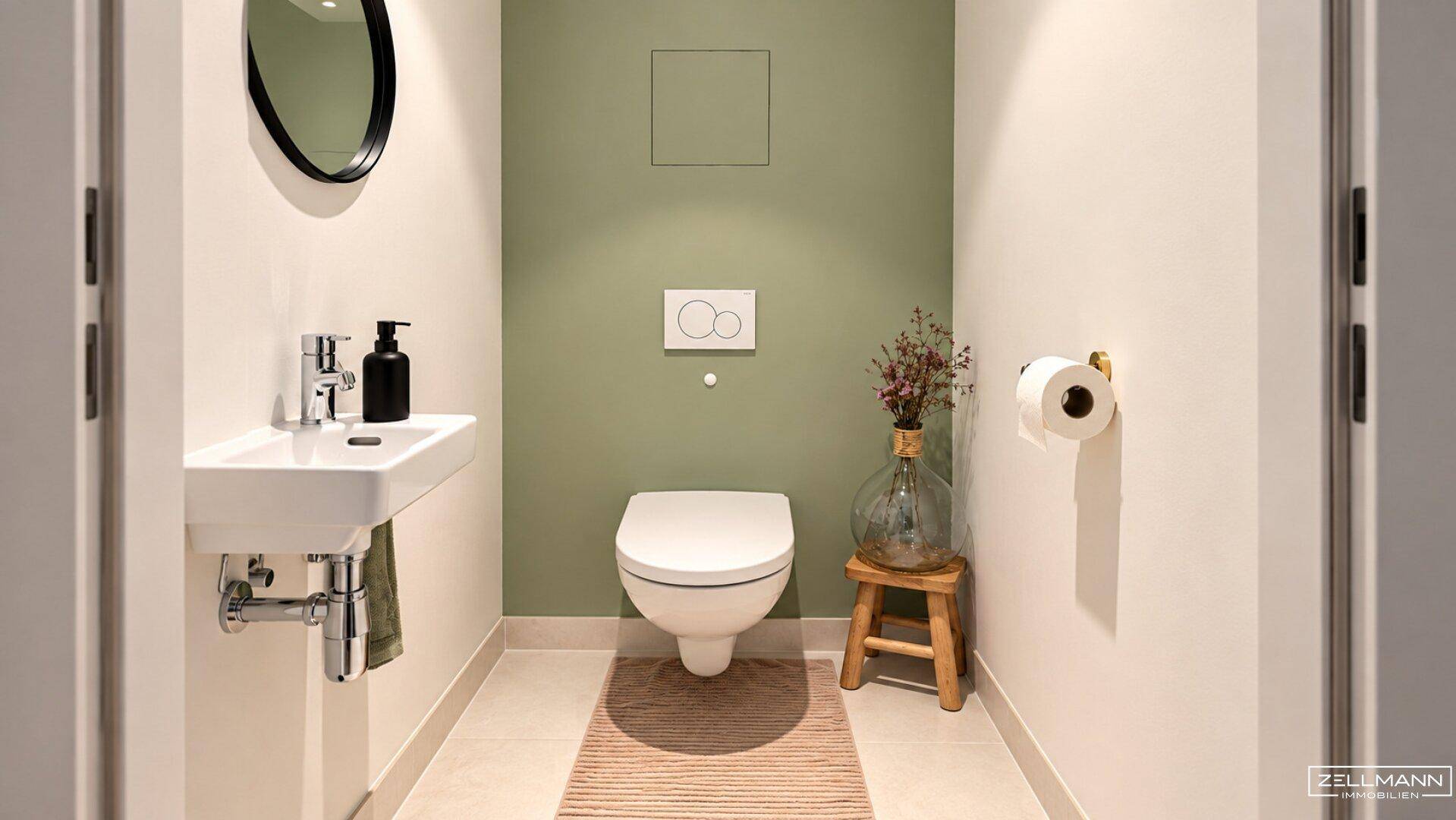 Modernes Gäste-WC mit Wand-WC, kleinem Waschbecken und grüner Akzentwand.