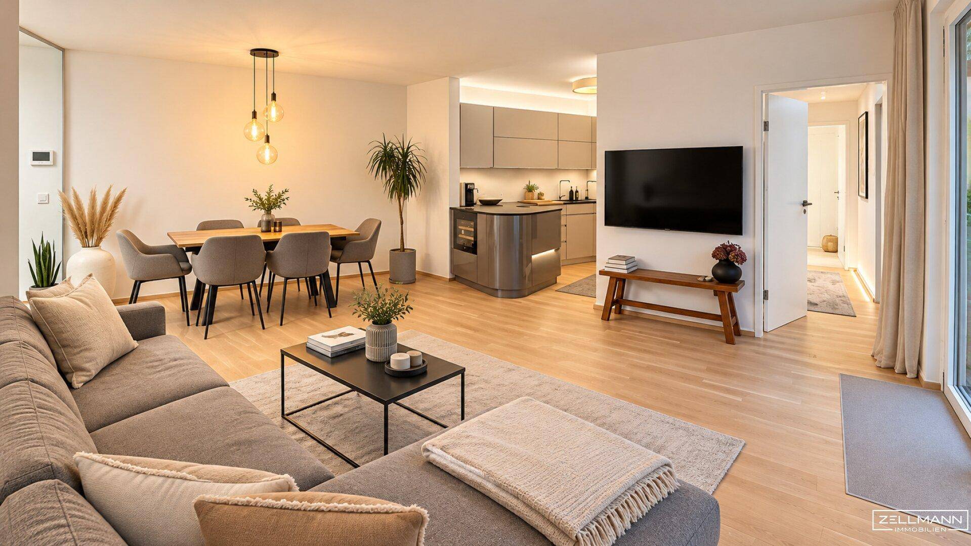 Helles, offenes Wohn- und Esszimmer mit moderner Küche und Zugang zur Terrasse.