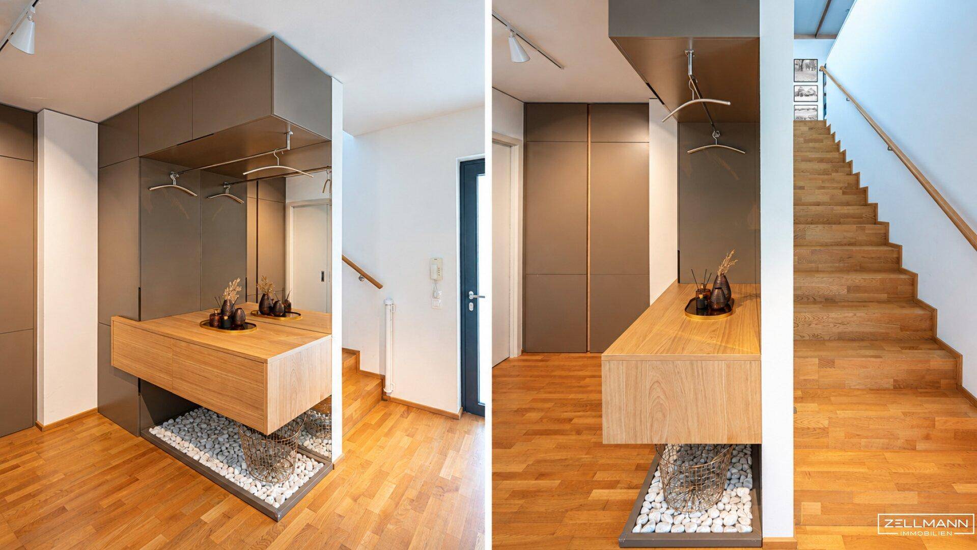 Moderner Eingangsbereich mit schwebender Holzkonsole, Spiegel und Treppenaufgang.