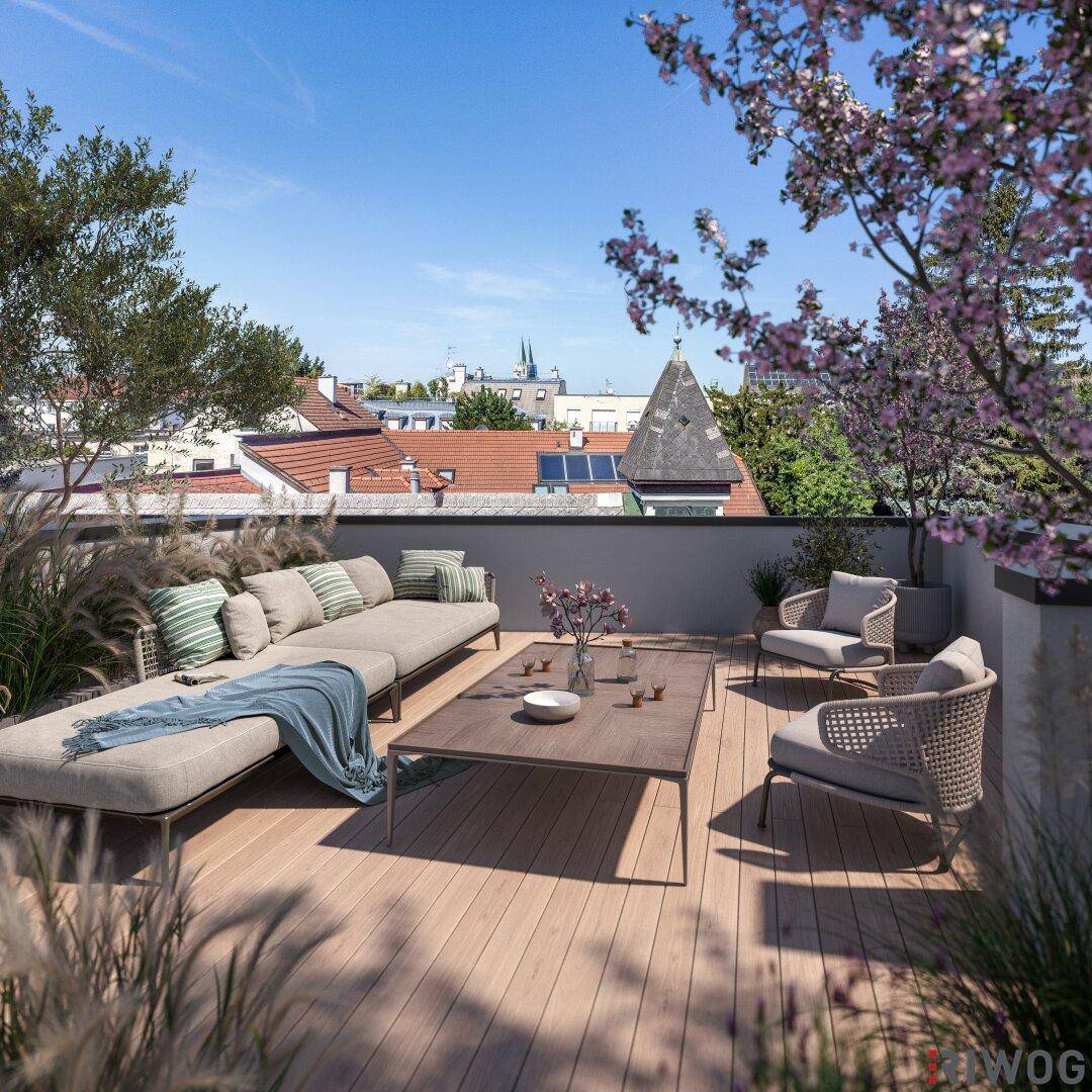 Geräumige Dachterrasse mit modernen Loungemöbeln und Blick über die Dächer der Stadt.