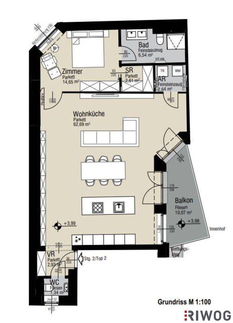 Grundriss einer Wohnung mit offener Wohnküche, Schlafzimmer, Bad und Balkon.