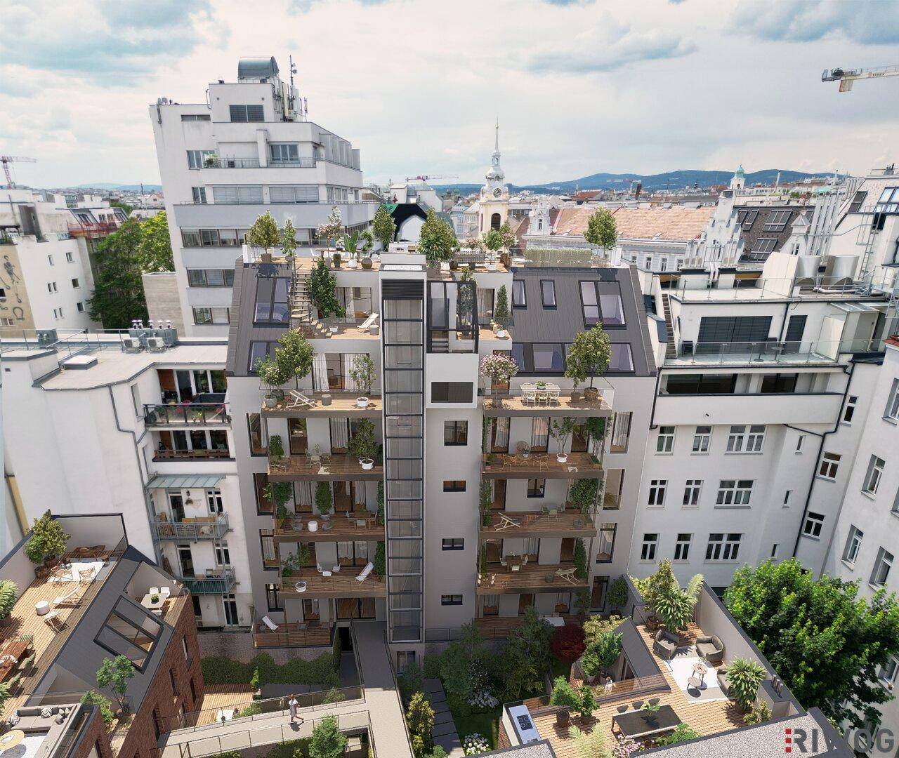 Luftaufnahme einer modernen Wohnanlage mit begrünten Terrassen und Balkonen im Herzen der Stadt.