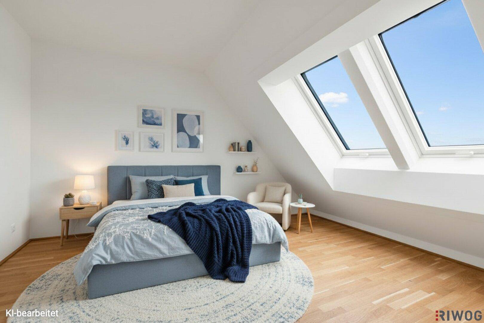 Modern eingerichtetes Schlafzimmer im Dachgeschoss mit Parkettboden und großen Dachfenstern.
