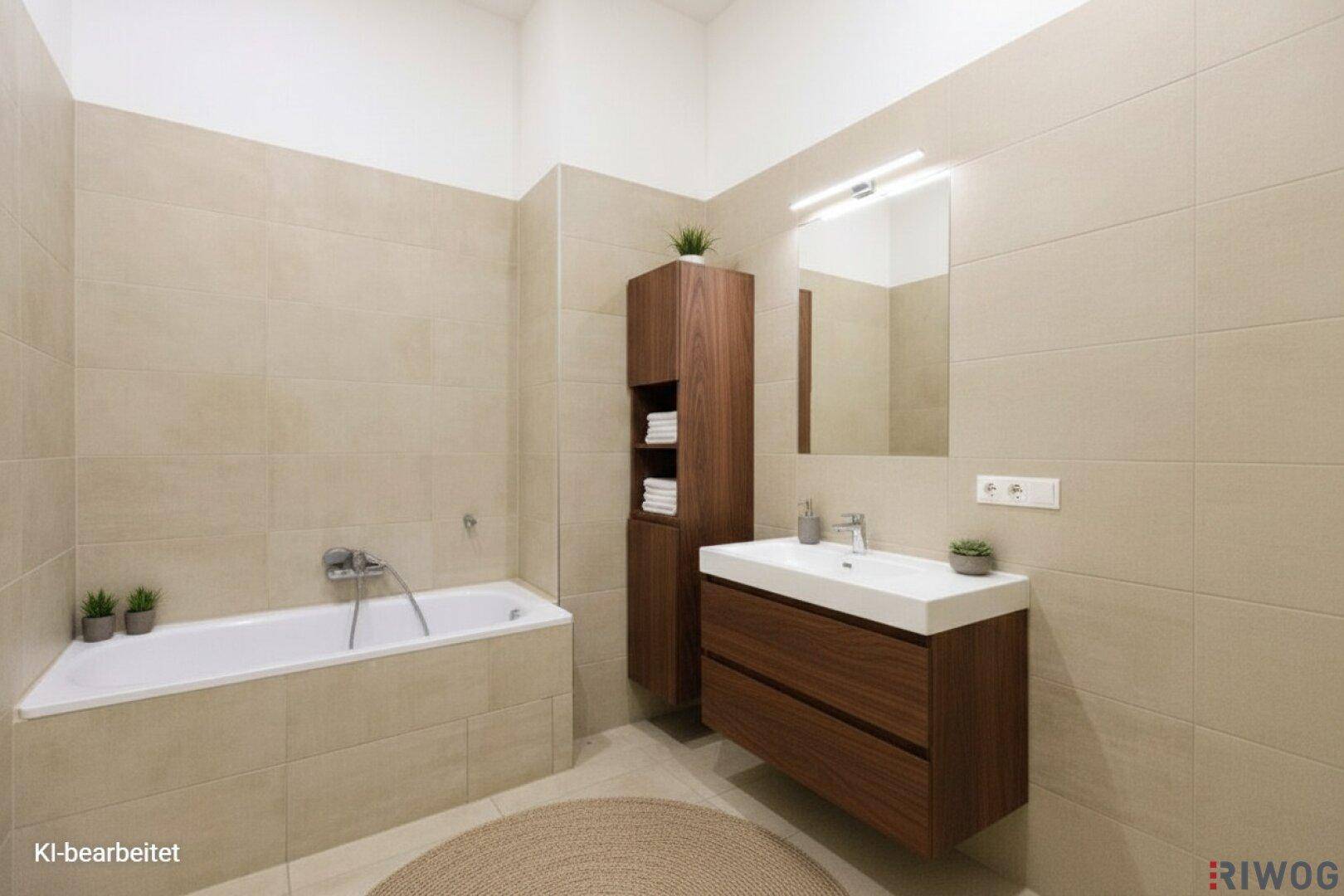 Modernes Badezimmer mit Badewanne, Waschtisch und beigefarbenen Fliesen.