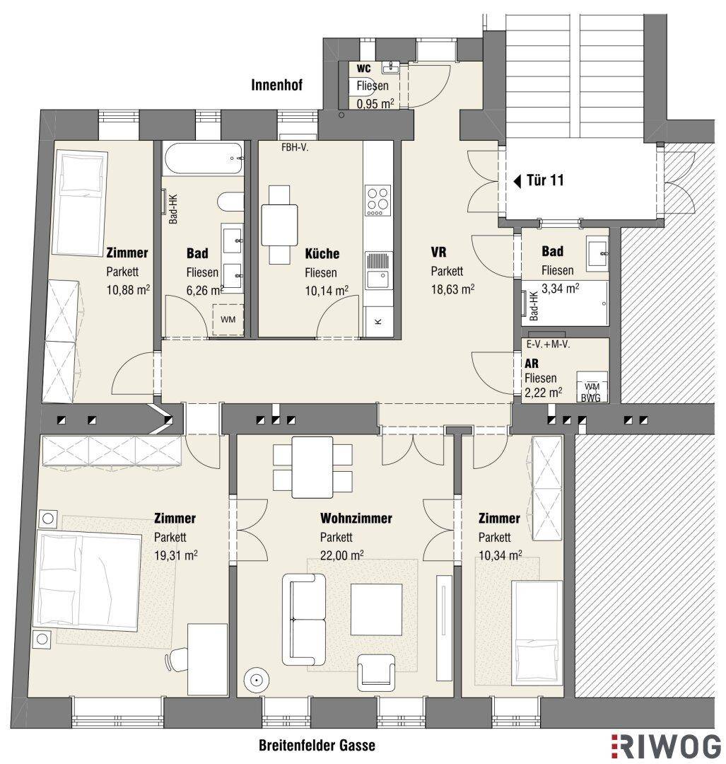 Grundriss einer Wohnung mit offenem Wohnbereich, zwei Bädern, separatem WC und Zugang zu einem Balkon.