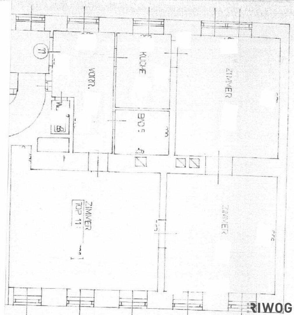 Grundriss einer Wohnung mit mehreren Zimmern, Küche und Bad.