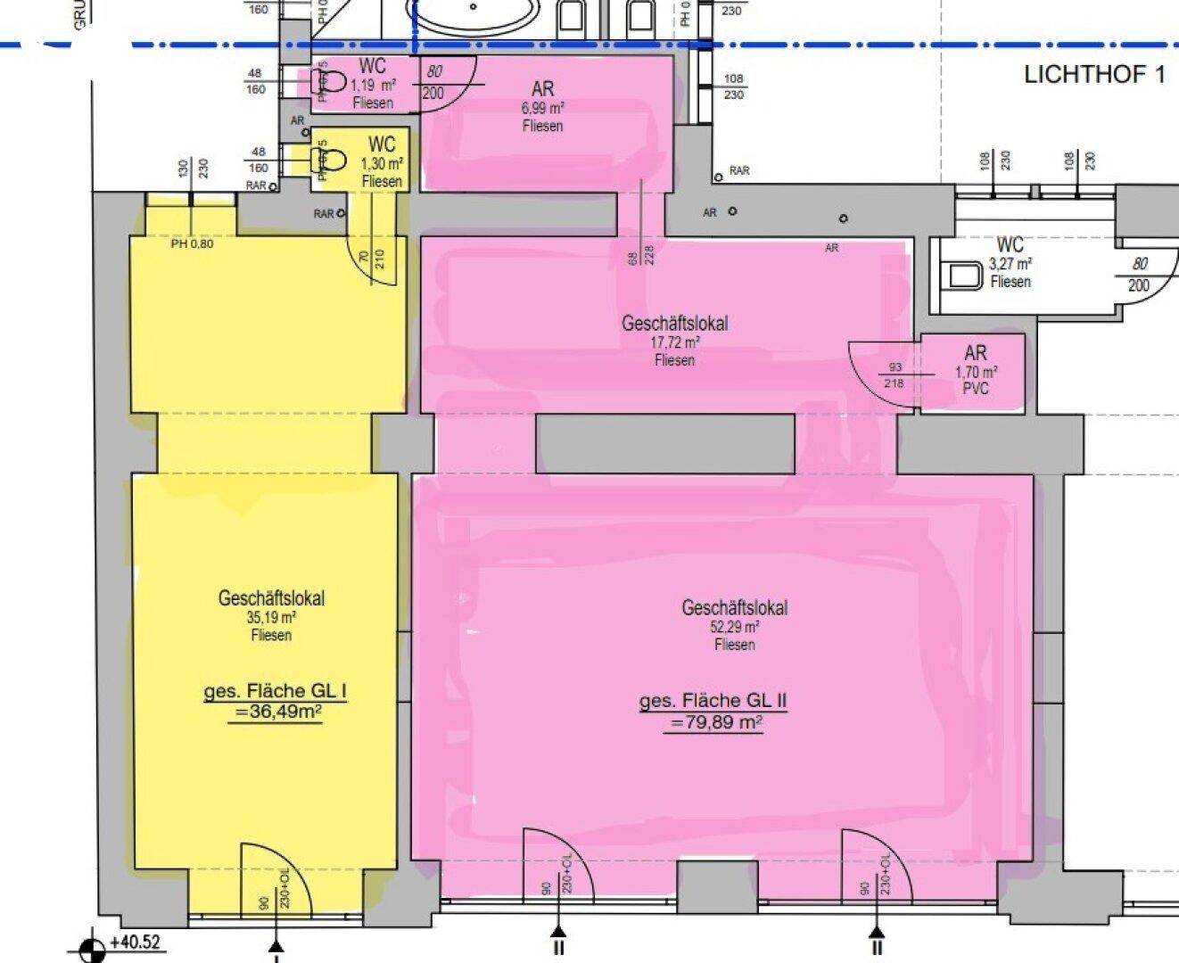 Grundrissplan mit mehreren Gewerbeflächen und Sanitärbereichen, farblich hervorgehoben.