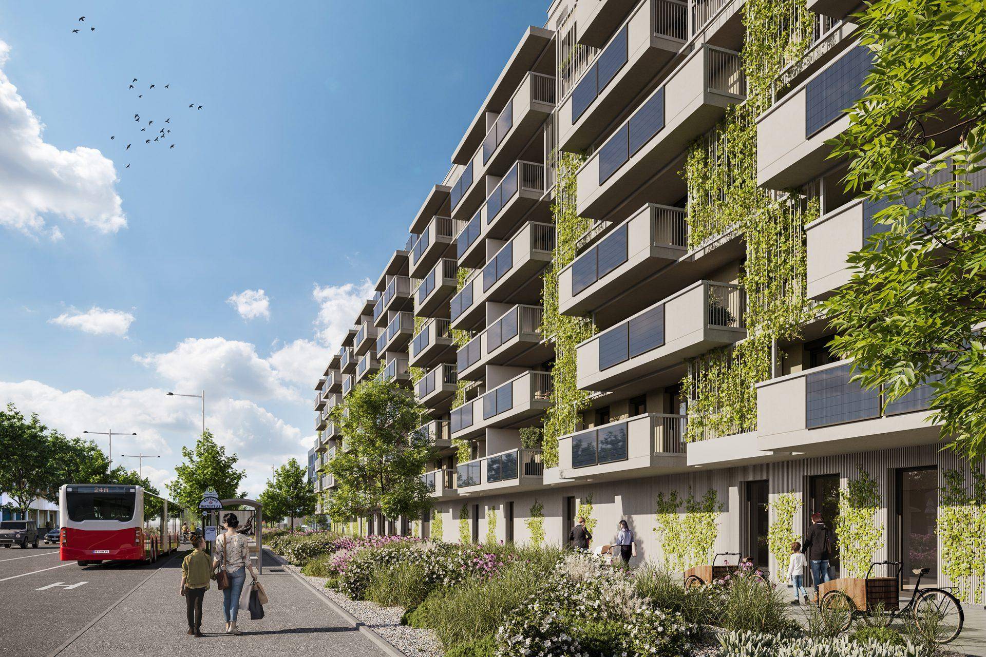 Fassade eines modernen Wohngebäudes mit zahlreichen Balkonen und vertikaler Begrünung entlang der Wände.