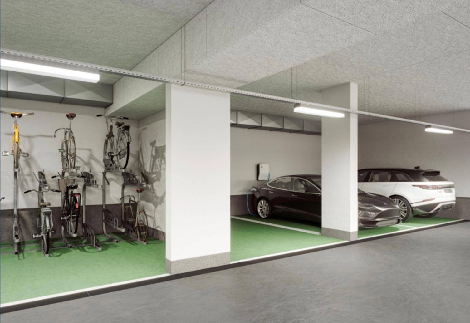Tiefgarage mit Fahrradstellplätzen und Ladestationen für Elektrofahrzeuge.
