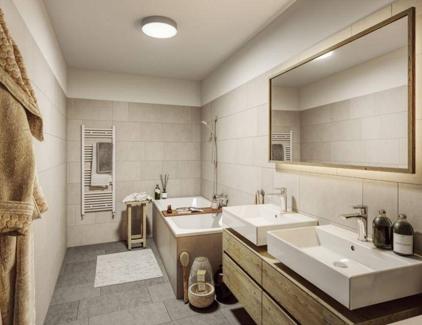 Modernes Badezimmer mit Doppelwaschbecken, Badewanne und beheiztem Handtuchhalter.