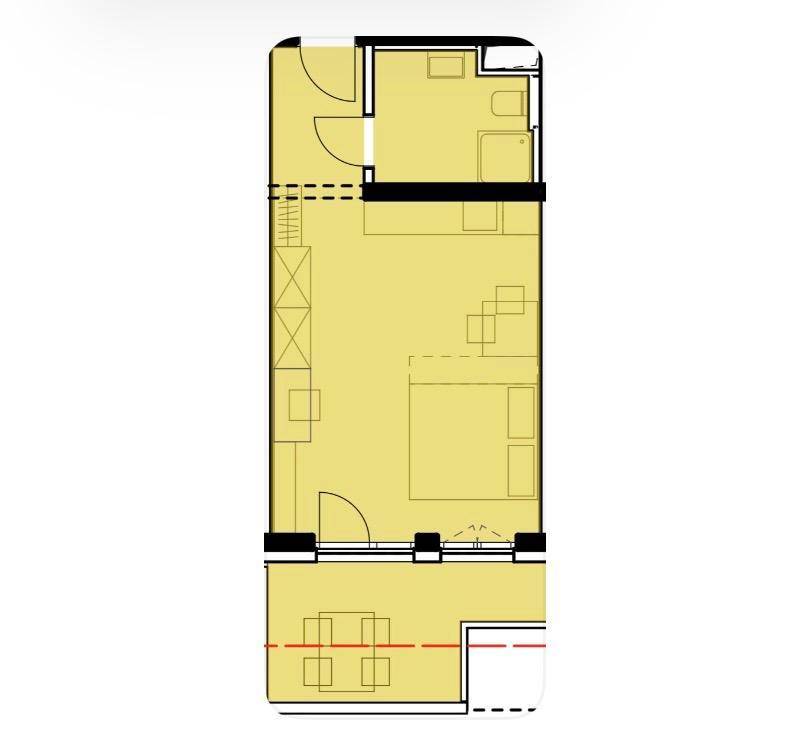 Grundriss einer Wohnung mit Schlafzimmer, Bad und offenem Wohnbereich.